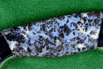"Zosma" obverse side view in T3 deep cryogenically treated 440C high chromium martensitic stainless steel blade, 304 stainless steel bolsters, Texas Moss Agate gemstone handle, sheath in leather shoulder inlaid with frog skin, nylon stitching "Zosma" obverse side view in T3 deep cryogenically treated 440C high chromium martensitic stainless steel blade, 304 stainless steel bolsters, Texas Moss Agate gemstone handle, sheath in leather shoulder inlaid with frog skin, nylon stitching