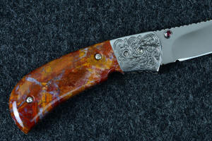 "Bellatrix" custom folding knife, reverse side view showing maker's mark, engraving detail, faceted garnets set in stainless steel, engraved screw fasteners