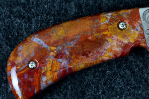 "Bellatrix" custom folding knife 6 power enlargement of reverse side handle scales, note the agate areas and depth of this fine, hard chalcedony gemstone