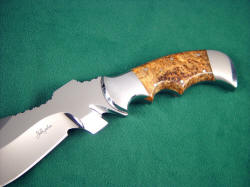 "Flamesteed" tactical survival knife: obverse side handle detail. Blade is complex and versatile